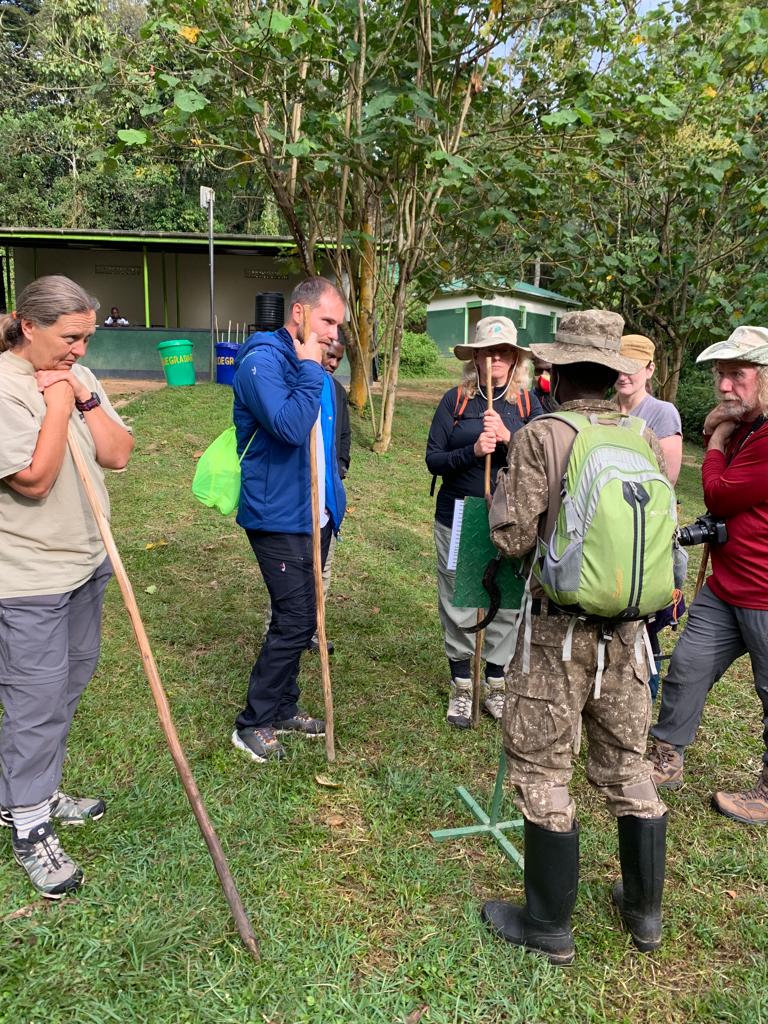 Tourist listening attentively to their dos and don'ts while trekking from their ranger