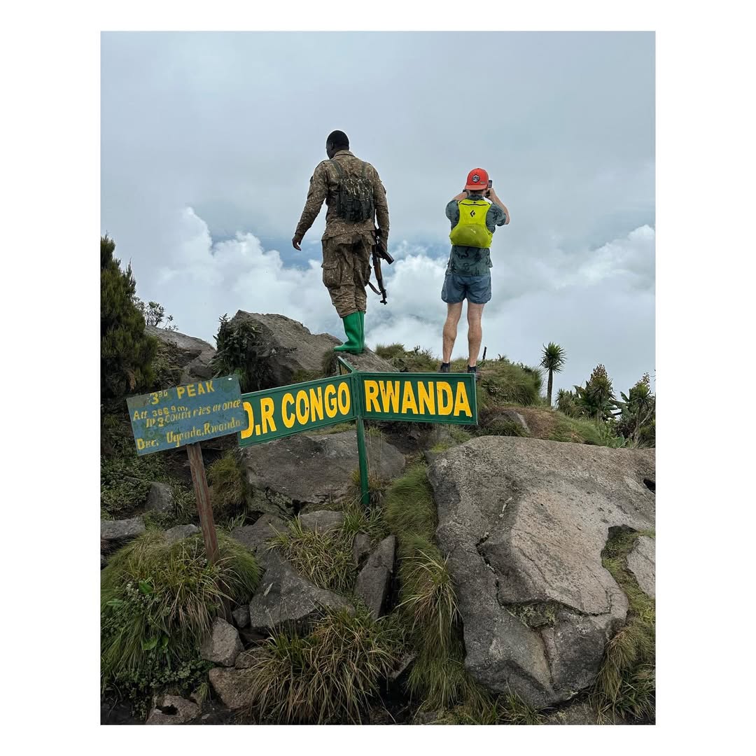Standing in 3 countries on Mt. Sabinyo